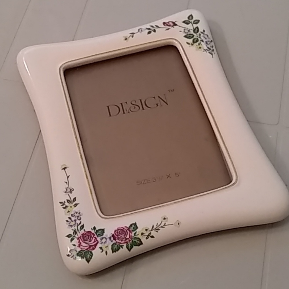 Lovely enamel frame w/floral design.   NWOT
